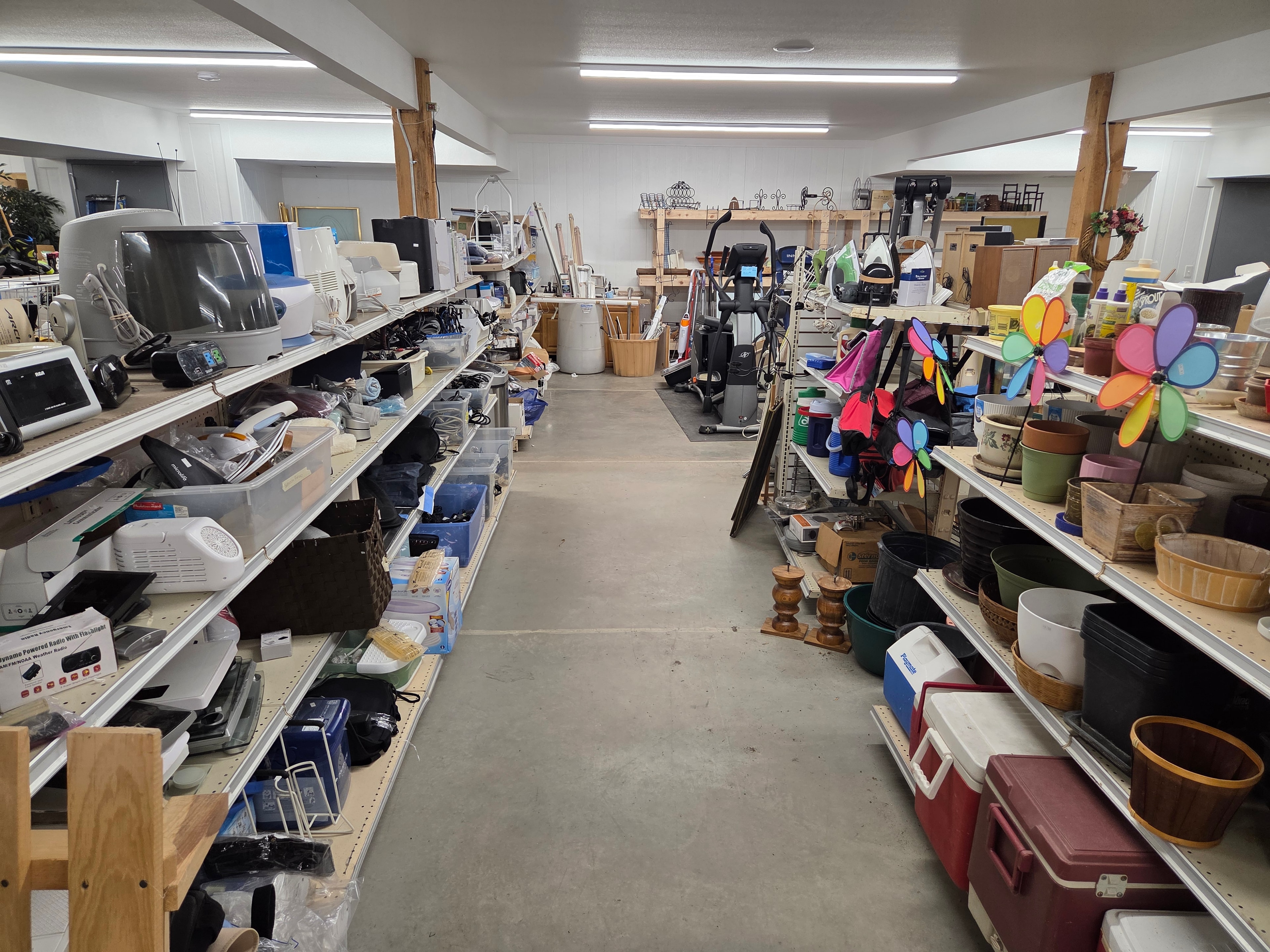 Basement shelves stocked with appliances and household goods