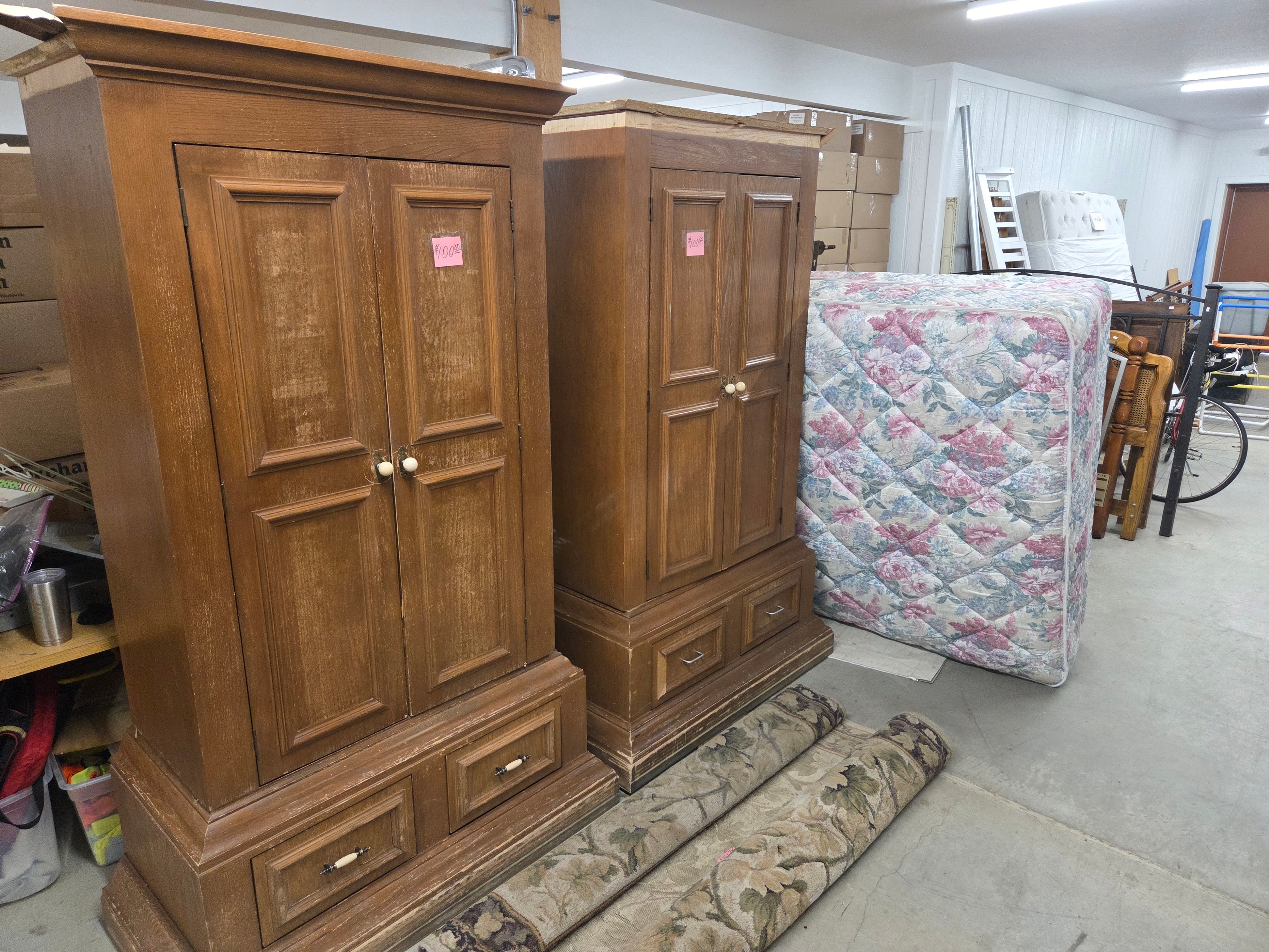 Wooden armoires and furniture with rugs in the basement