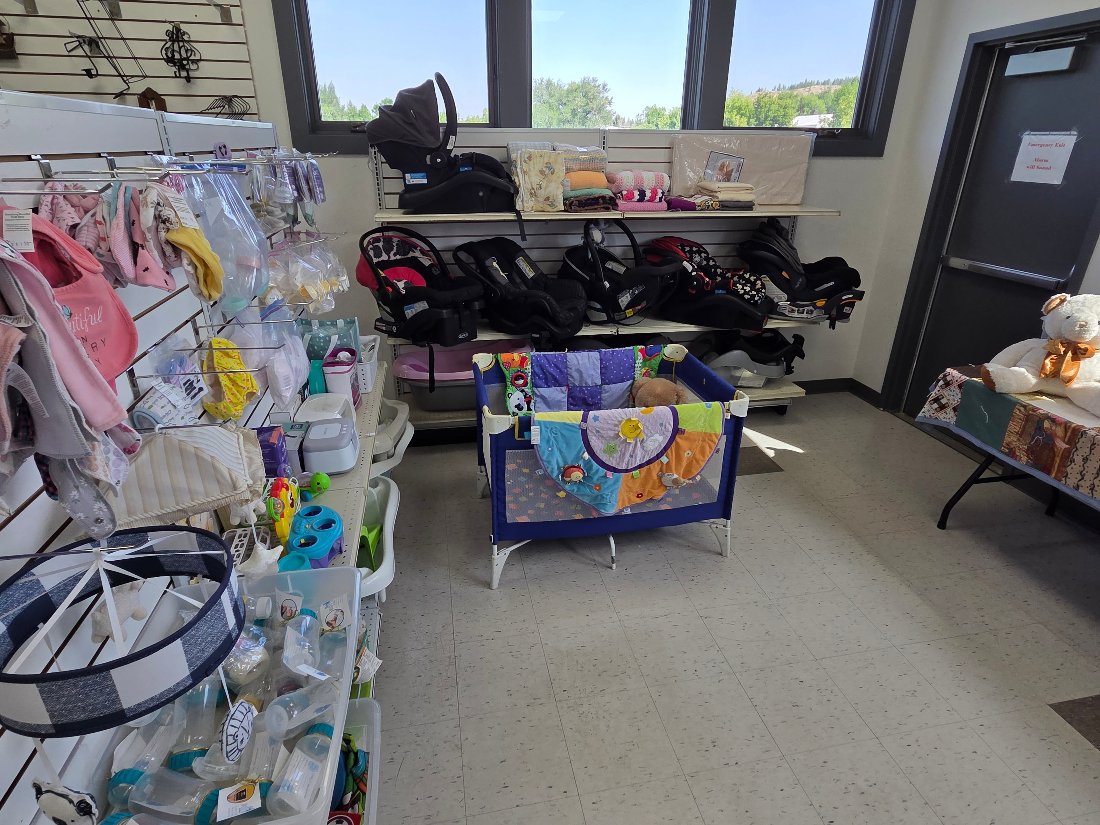 Main floor baby clothing, car seats, toys, and nursery items