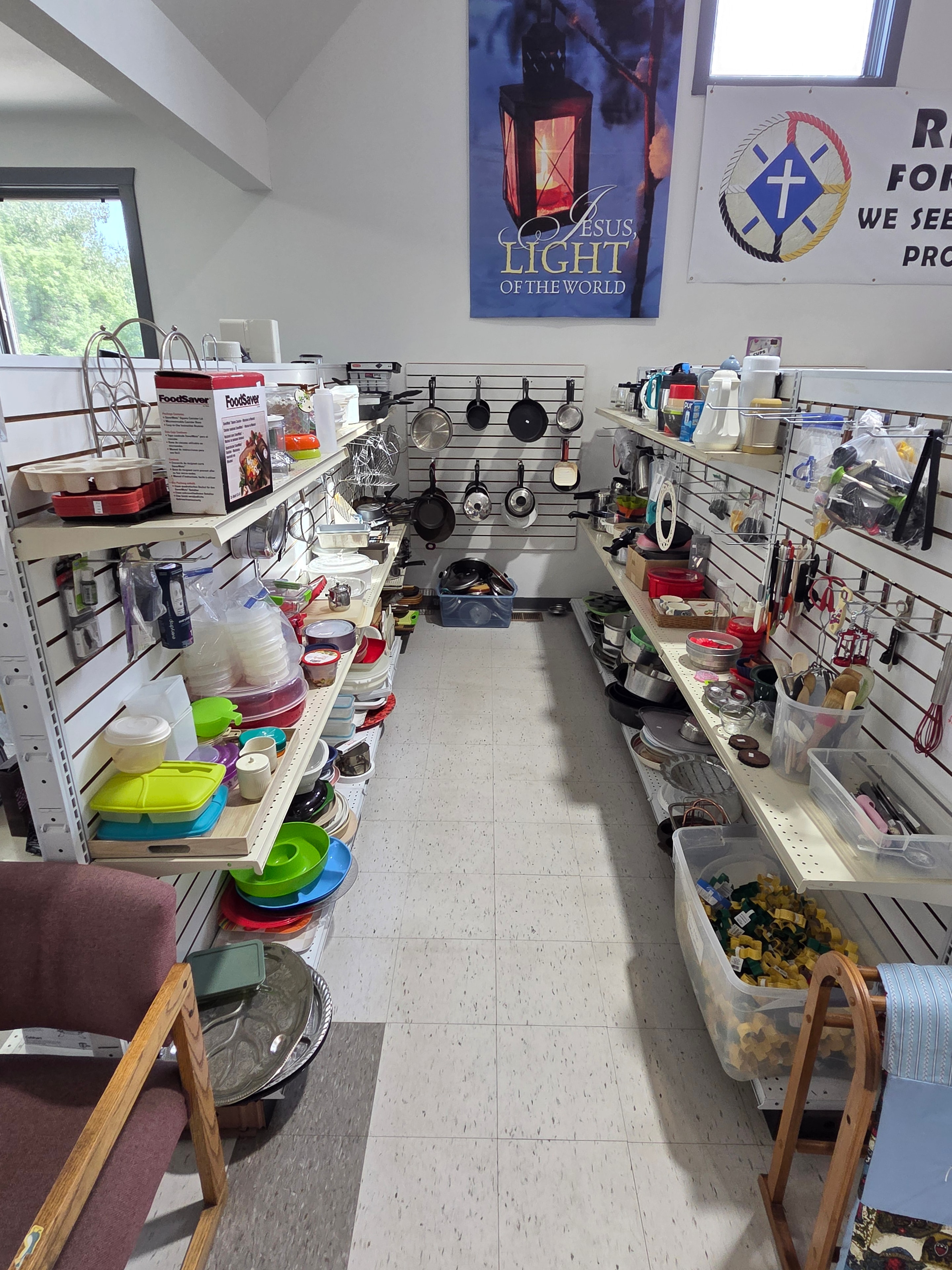 Main floor shelves stocked with household goods and kitchenware